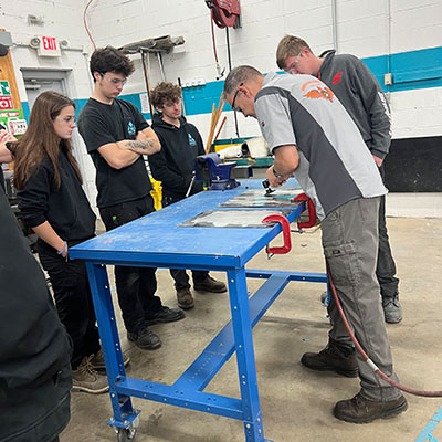 Dynabrade tool demo with auto tech trainees